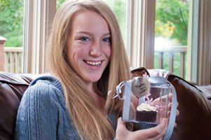 Girl with a party favor cupcake